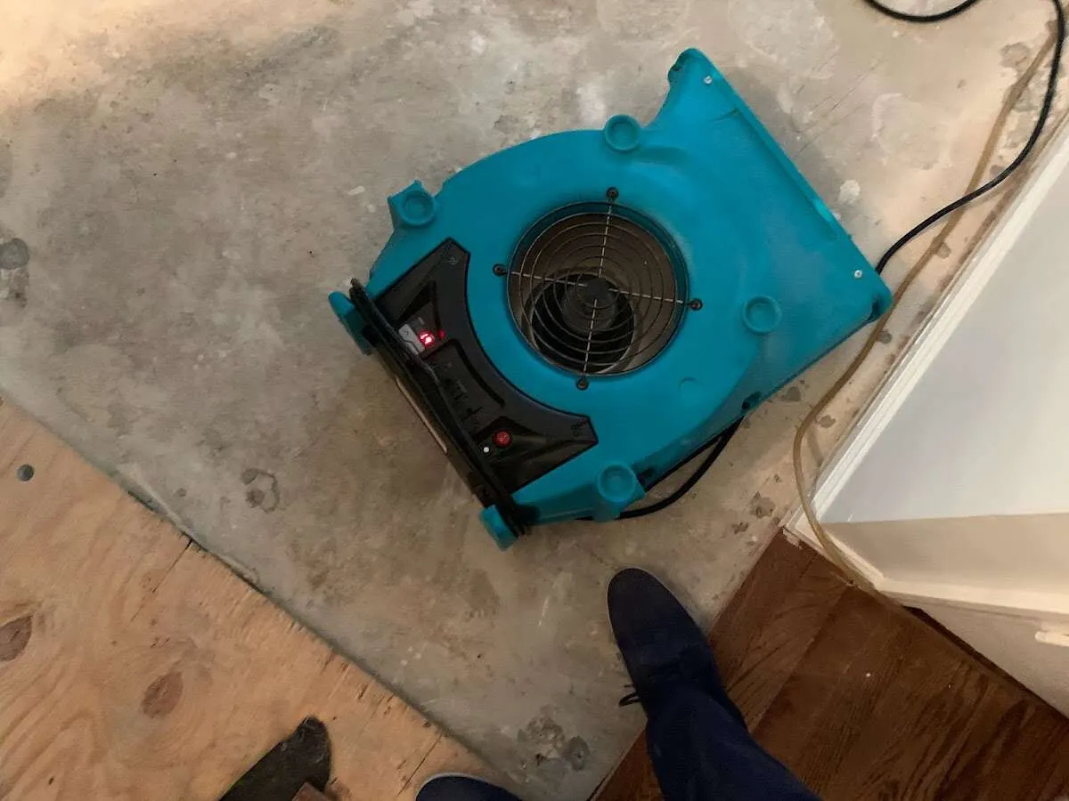 Air mover drying subfloor during Leak Detection & Repair in South Middleton